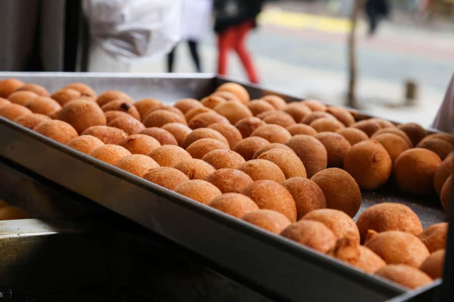 Bogota Food Tour with over 12 Tastings & Tejo - A chicheria taste and the buñuelos plus avena combo
